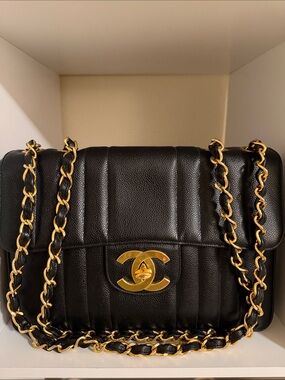 CHANEL Black Quilted Leather Shoulder Bag with Gold Chain and CC Lock